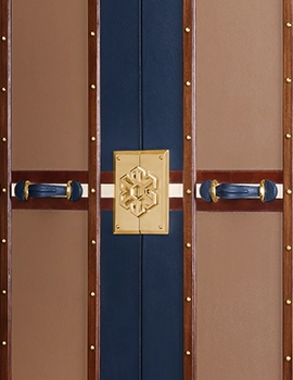 exterior with leather finish, Evolution insignia, brass hardware, and crystalware